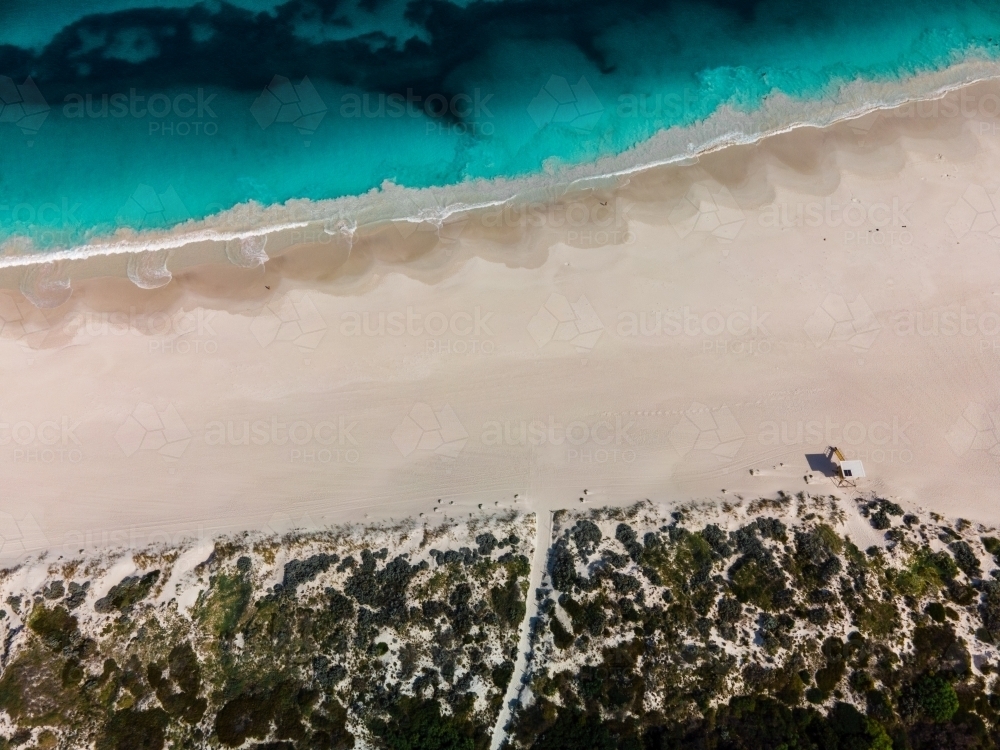 top shot of Summers in Perth with white sand, green grass and ocean water - Australian Stock Image