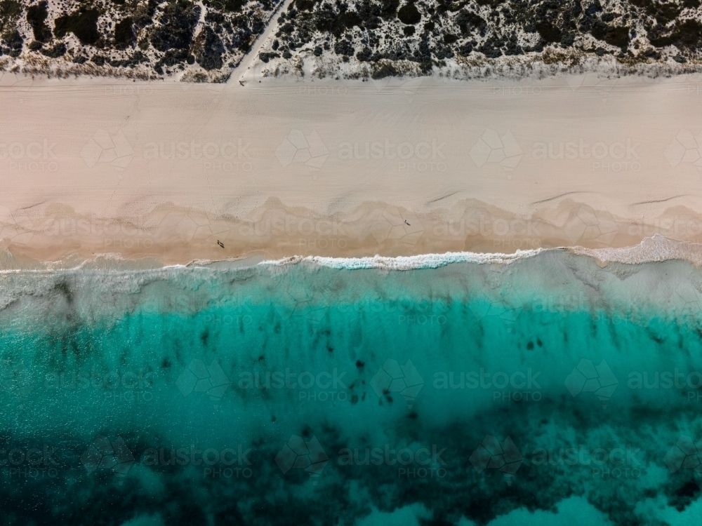 top shot of Summers in Perth with white sand, green grass and ocean water - Australian Stock Image