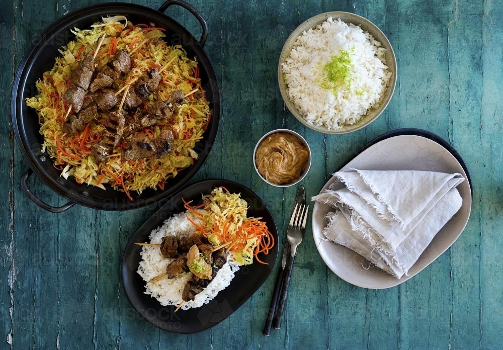 Top view of beef skewers and rice dish meal - Australian Stock Image