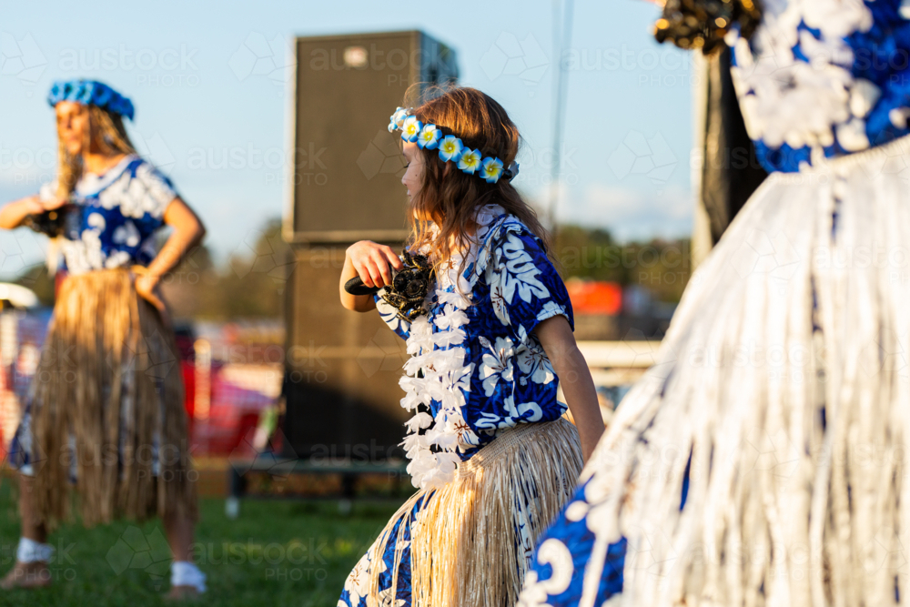 Torres Strait Islander child dancing and performing traditional dance at cultural spectacular event - Australian Stock Image