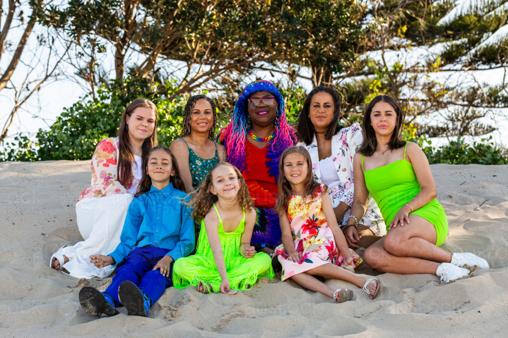 Torres Strait Islander family with grandmother adult daughters and grandchildren together at beach - Australian Stock Image