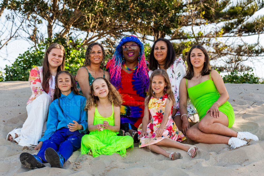Torres Strait Islander family with grandmother adult daughters and grandchildren together at beach - Australian Stock Image