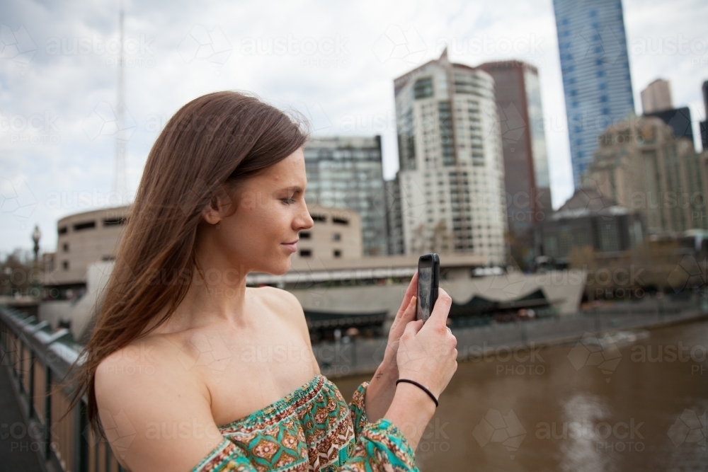 Tourist Taking Photo on Phone of Yarra River : Austockphoto Tourist Taking Photo on Phone of Yarra River - Australian Stock Image