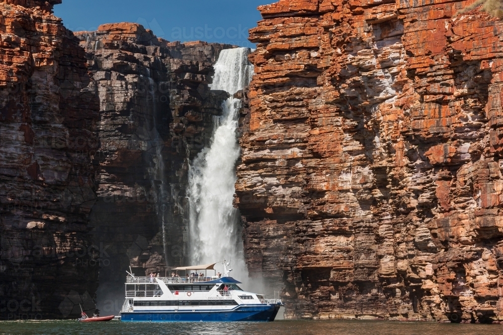 Tourist vessel at foot of King George Falls. - Australian Stock Image