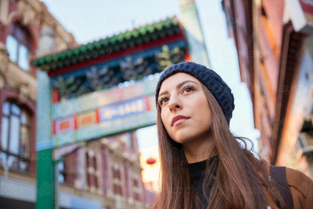 Tourist Waiting at Chinatown Entrance - Australian Stock Image