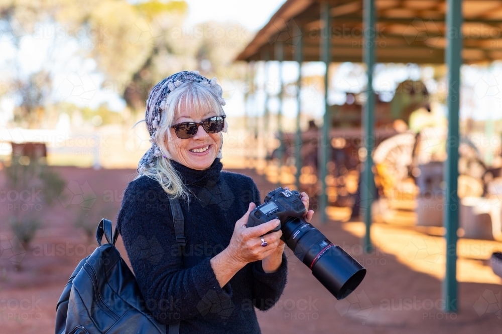 tourist with a camera at historic site - Australian Stock Image