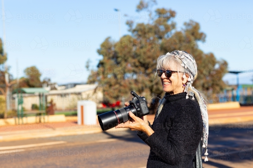 tourist with camera at historic site - Australian Stock Image
