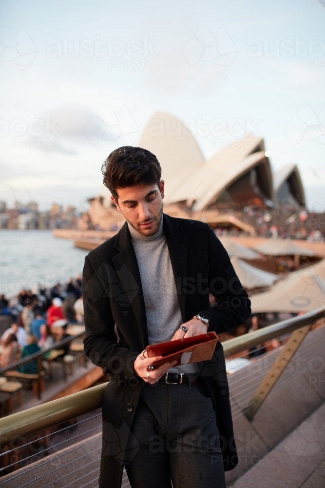 Tourist with the Sydney Opera House in background - Australian Stock Image