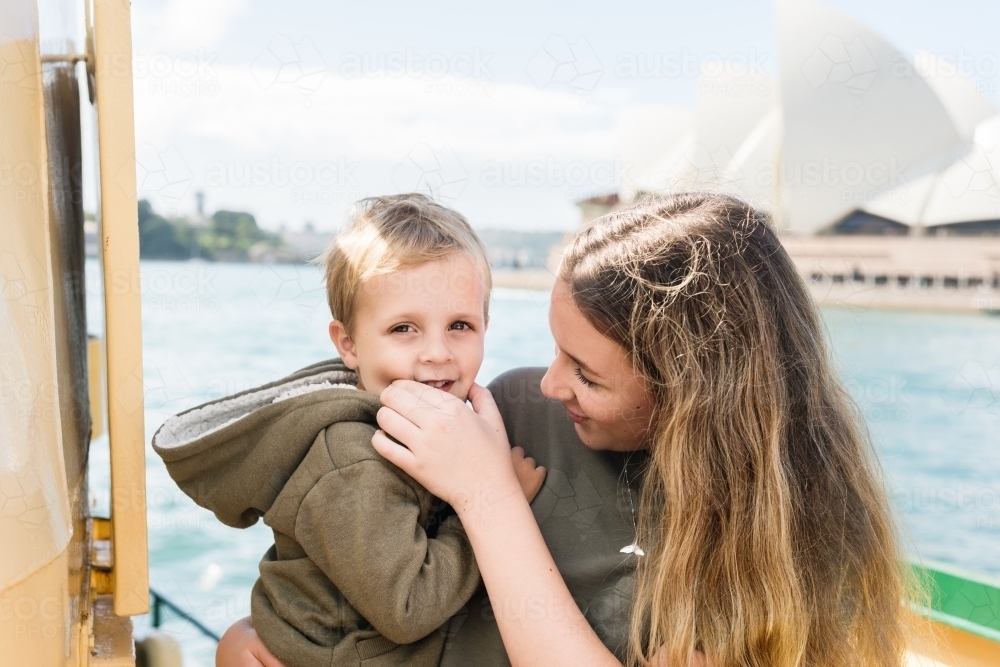 tourists on ferry in front of sydney opera house - Australian Stock Image