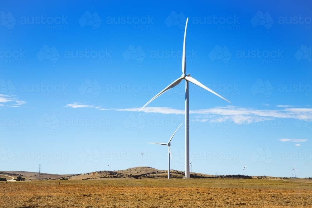 Towers in a wind farm with blue sky - Australian Stock Image