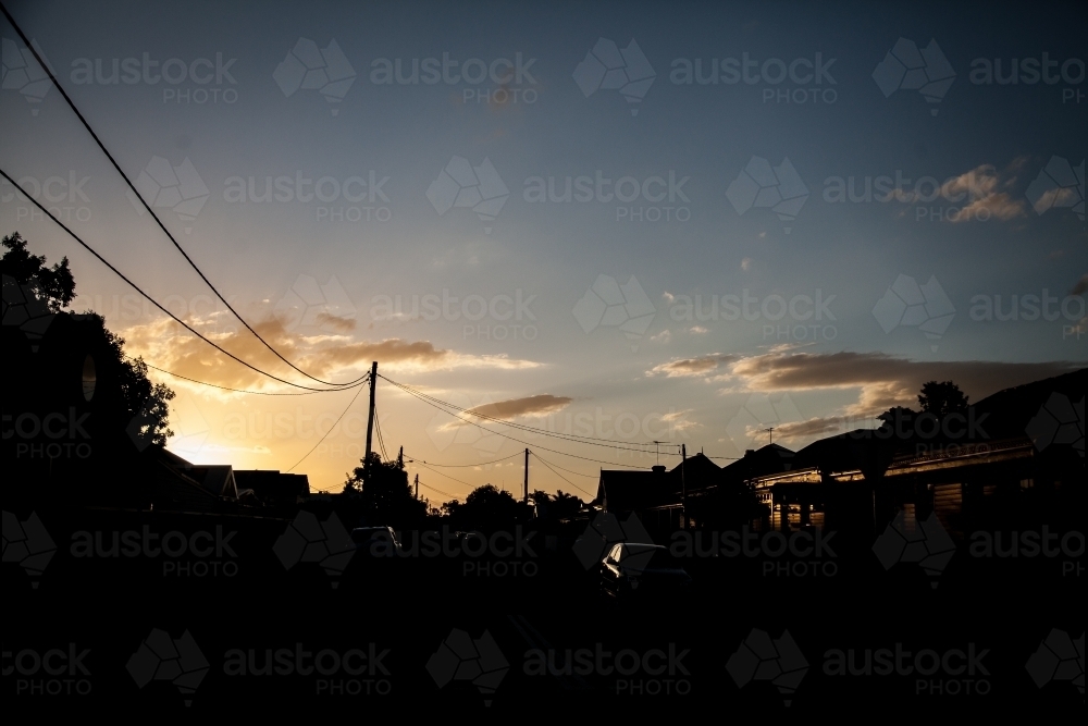 Town house buildings silhouetted against sunset - Australian Stock Image