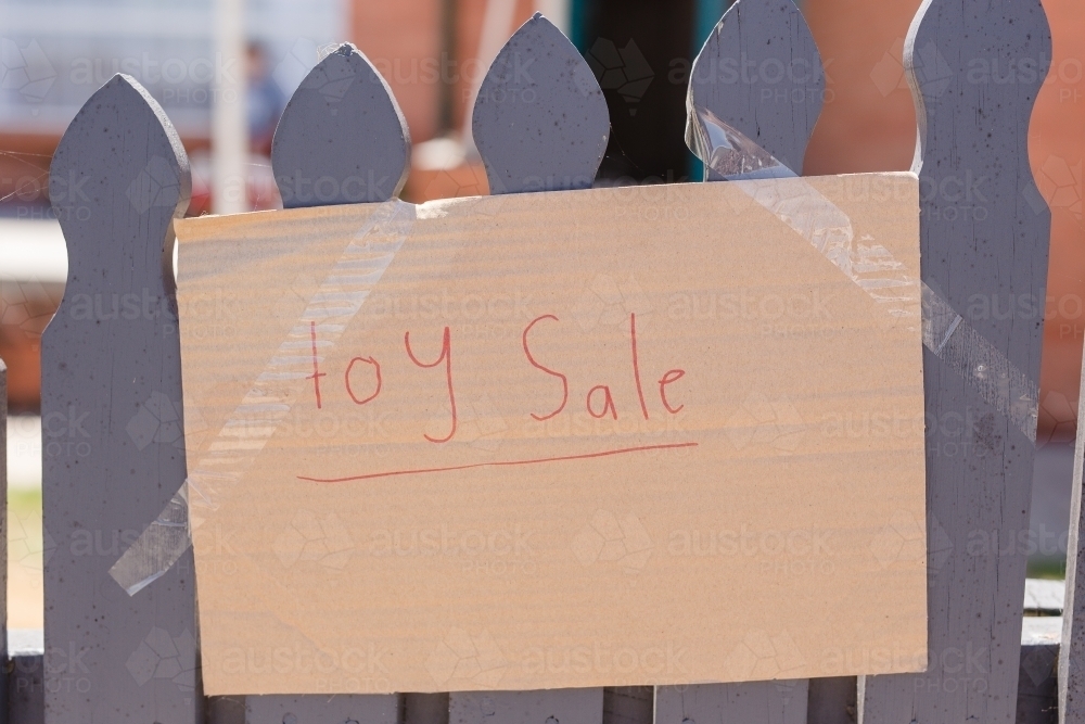 "Toy Sale" cardboard sign on fence - Australian Stock Image