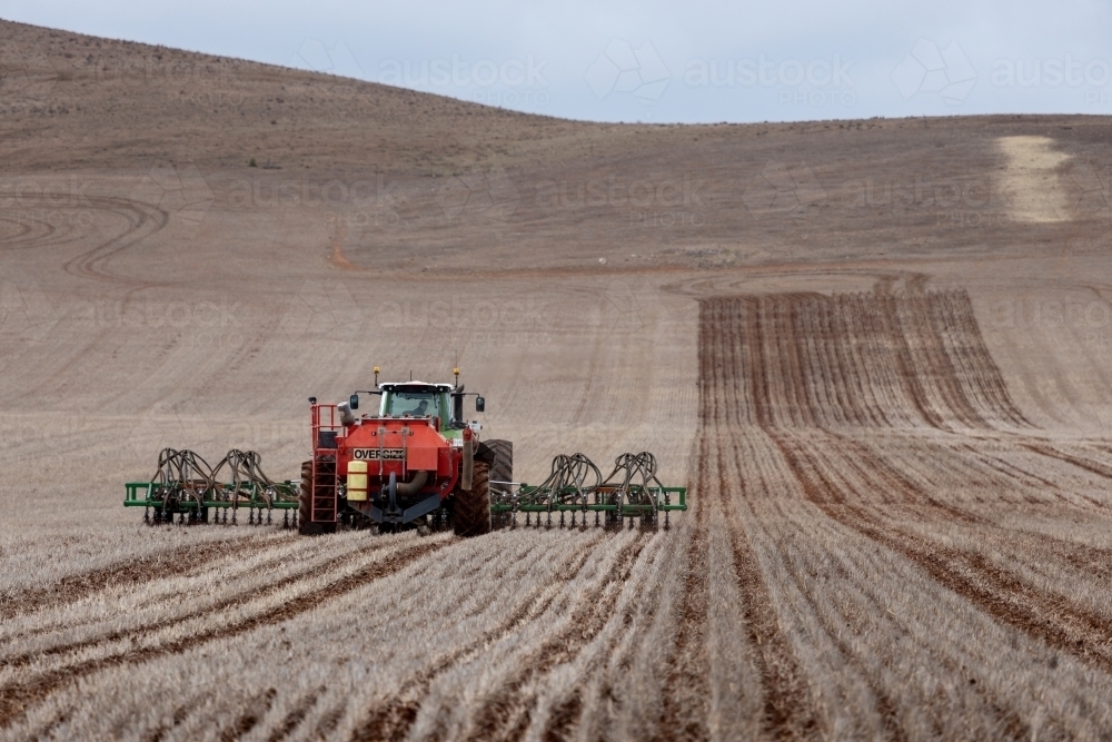 tractor and air seeder sowing a paddock - Australian Stock Image