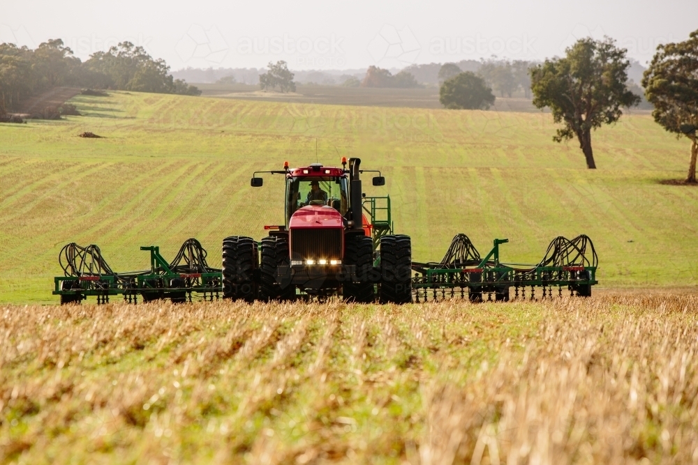 Tractor and plow precision seeding paddock - Australian Stock Image