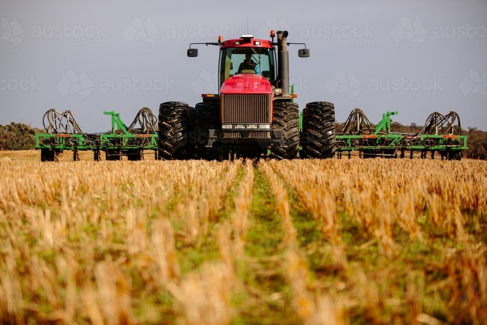 Tractor and plow precision seeding paddock - Australian Stock Image