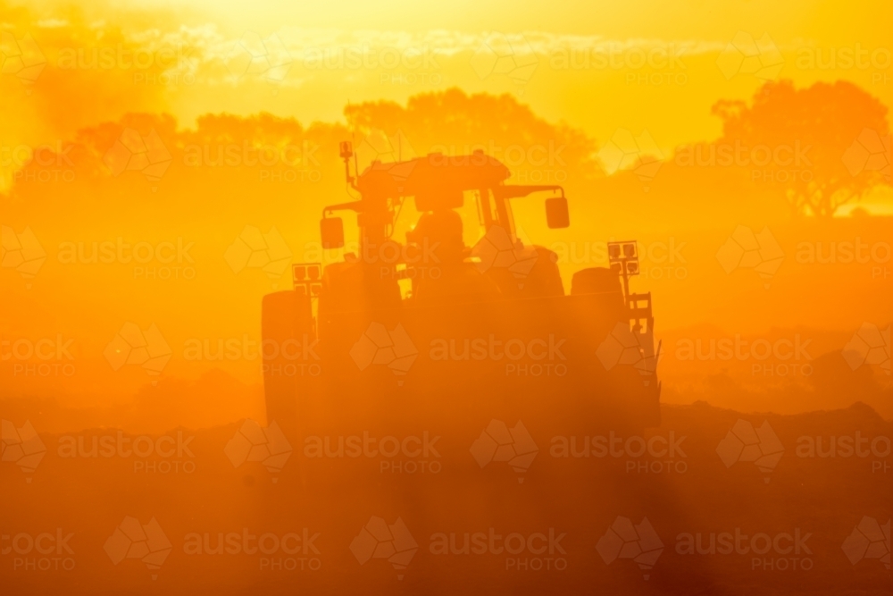 tractor on sunset - Australian Stock Image