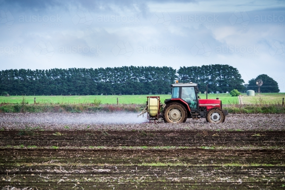 Tractor with sprayer preparing the paddocks - Australian Stock Image