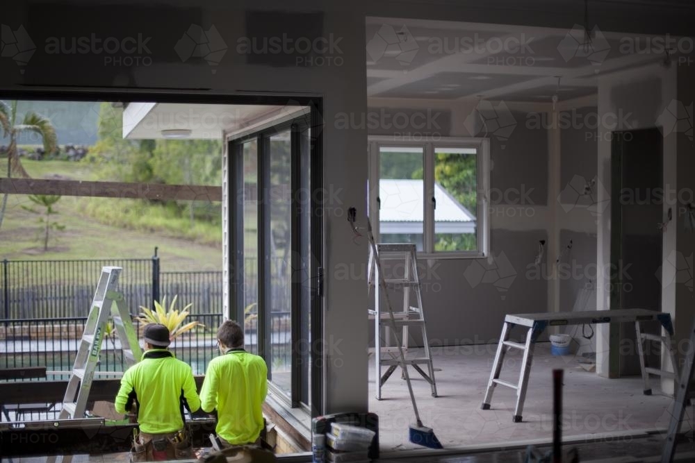 Tradesmen working on a home renovation. - Australian Stock Image
