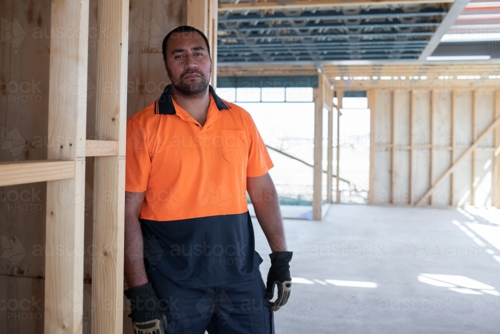 Tradie at work on house building site - Australian Stock Image