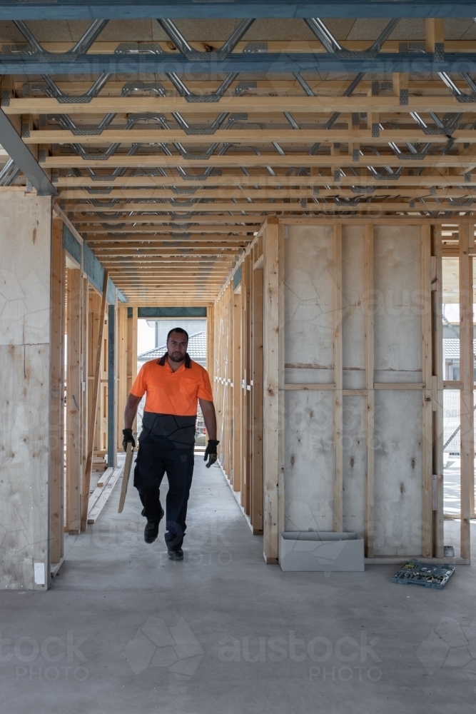 Tradie at work on house building site - Australian Stock Image