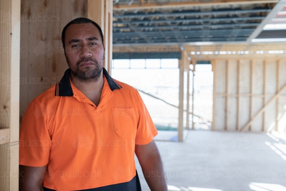 Tradie at work on house building site - Australian Stock Image