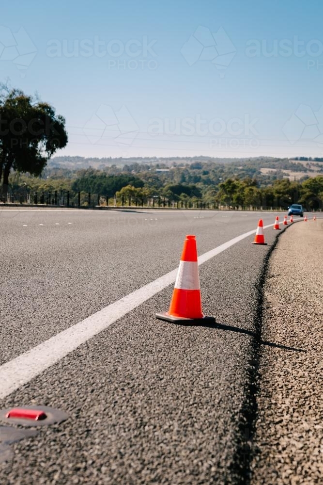 Image of traffic cones on the side of highway Austockphoto
