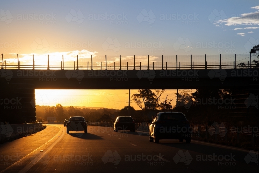 Traffic driving on road at dusk - Australian Stock Image