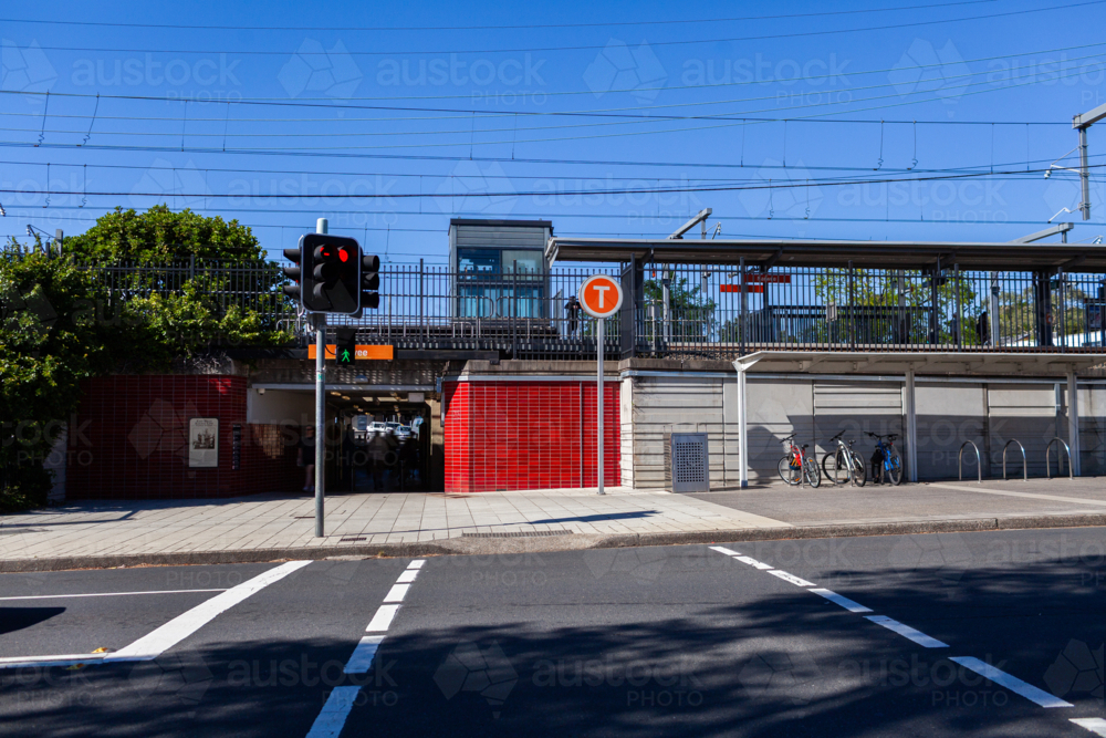 Intersection Station Image of traffic lights at road intersection by train station platform ...