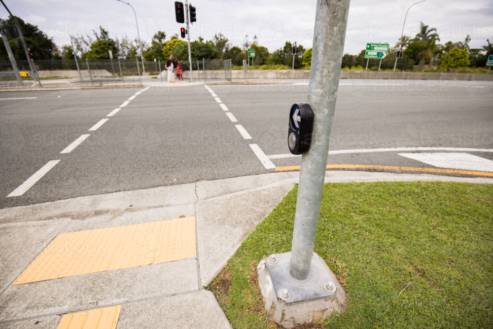 Traffic lights pedestrian crossing button on major road - Australian Stock Image