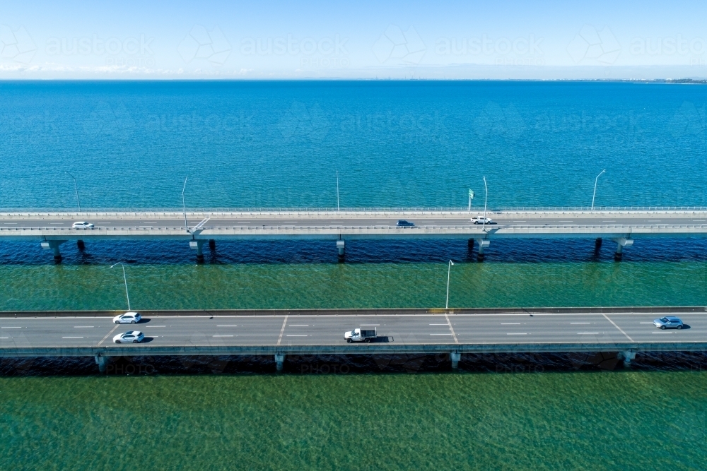 Traffic on two bridges over water. - Australian Stock Image