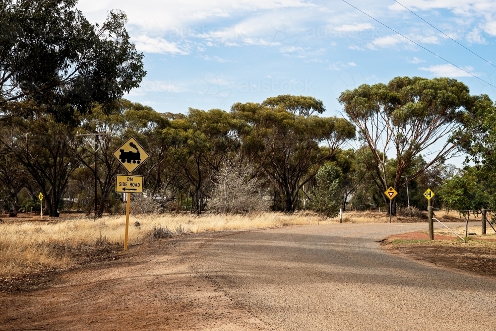 Train crossing road sign in country town - Australian Stock Image