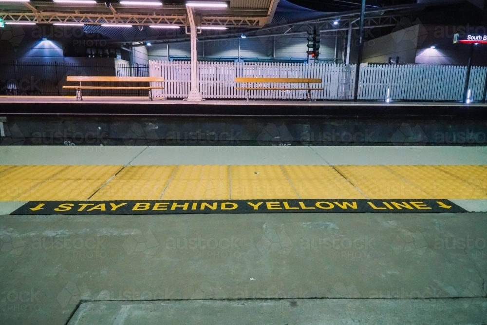 Image of Train station platform yellow line - Austockphoto