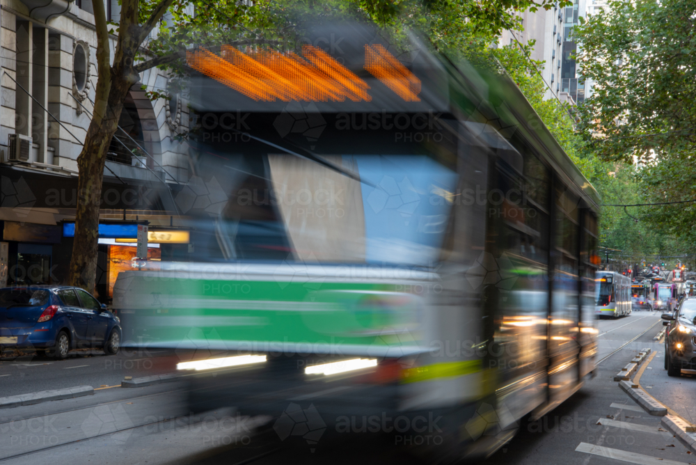 Tram on Collins street motion blur long exposure in city - Australian Stock Image