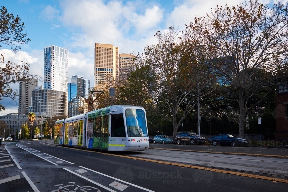 Tram Towards Melbourne CBD on Autumn Evening - Australian Stock Image