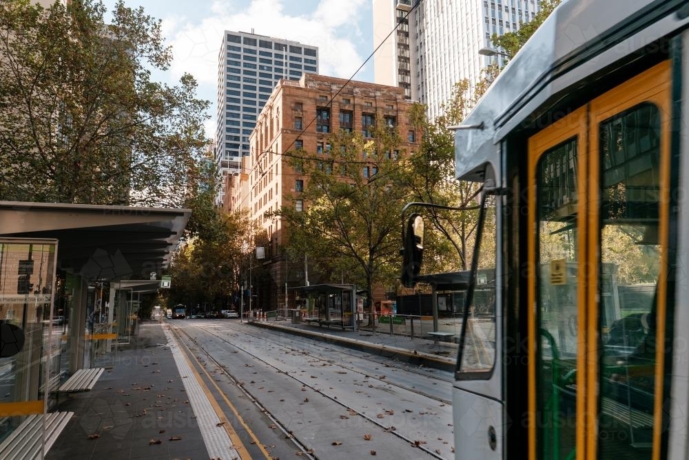 Tram travelling East on Collins St, Melbourne - Australian Stock Image
