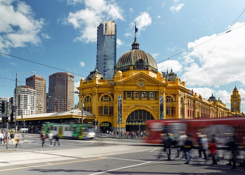 Trams and pedestrians at Flinders Street Station - Australian Stock Image