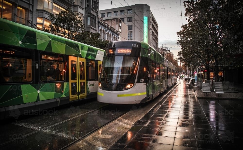 Trams on Bourke St. Mall - Melbourne CBD early morning - Australian Stock Image