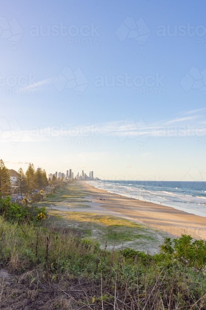 Tranquil beach afternoon with view of the Gold Coast city skyline - Australian Stock Image