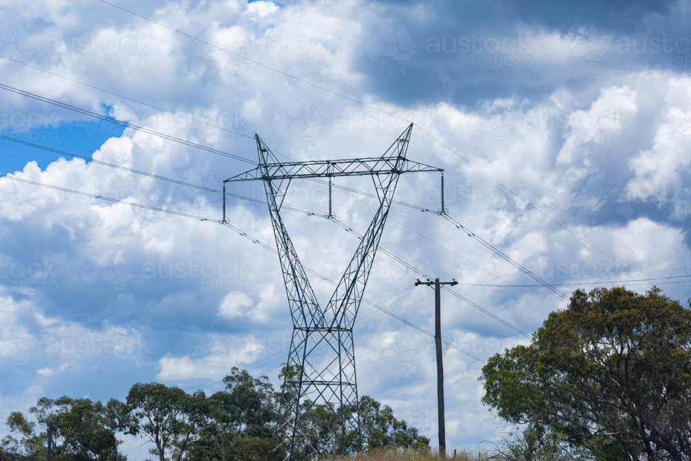 transmission tower electricity pylons in rural Australia transporting power through country - Australian Stock Image