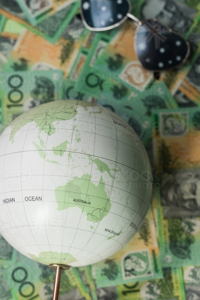 travel concept, globe and australian money - Australian Stock Image