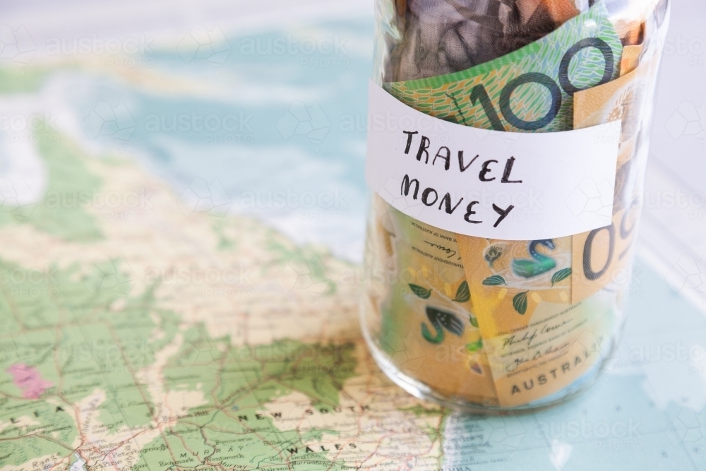 Travel in Australia concept with money and map - Australian Stock Image