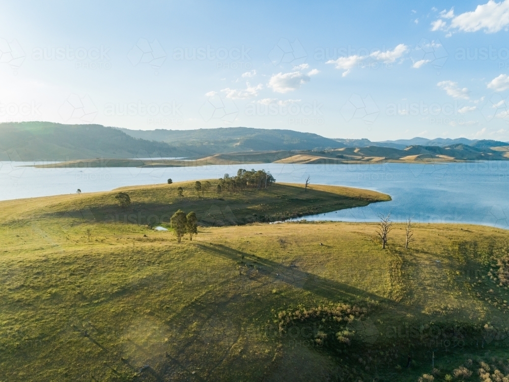 Image of trees and wide green paddock in afternoon like beside Lake St ...