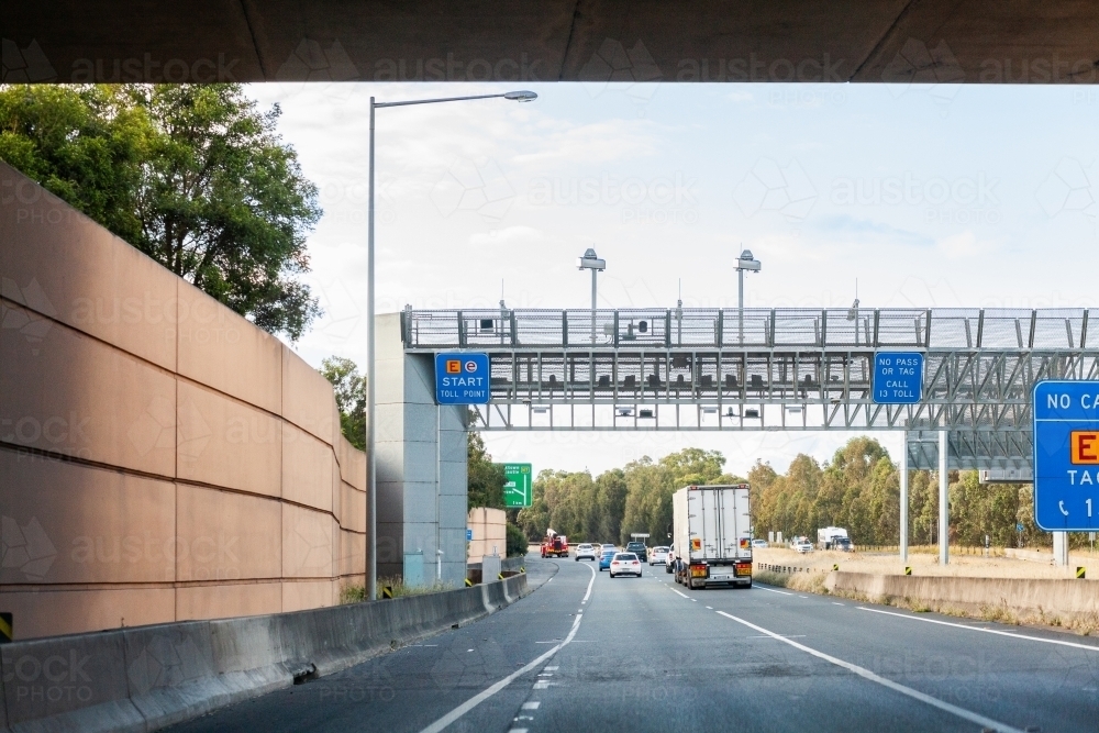 Tag Point Sign Image of Truck on highway road passing under E-Toll e-tag point on ...