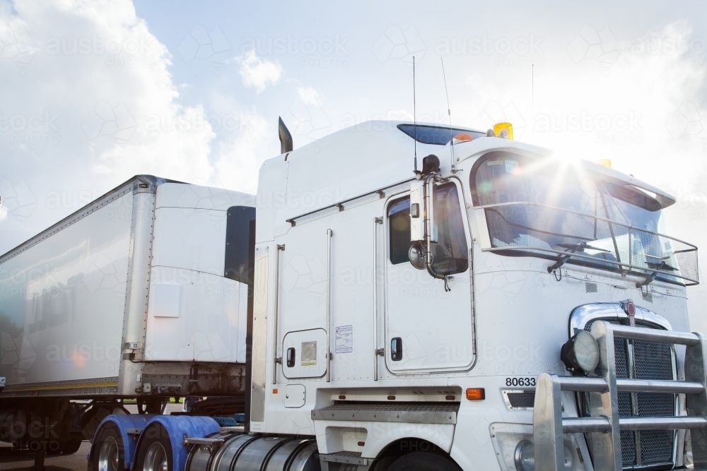 Truck with sun flare over it - Australian Stock Image