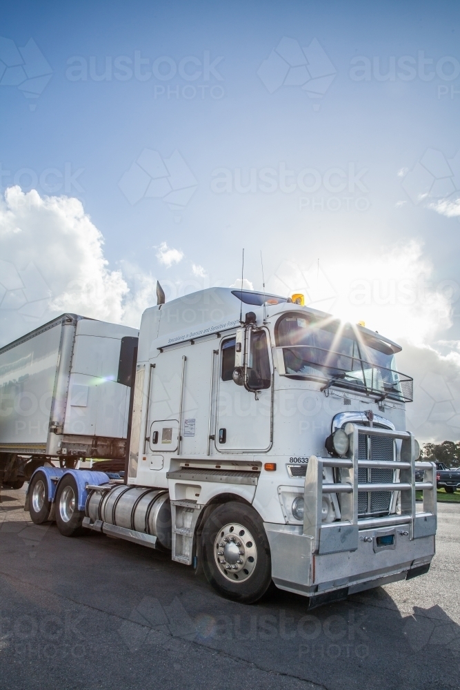 Truck with sun flare over it - Australian Stock Image