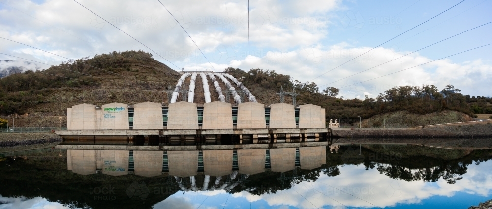 Tumut 3 power station reflected in water, part of the snowy hydro electric scheme - Australian Stock Image
