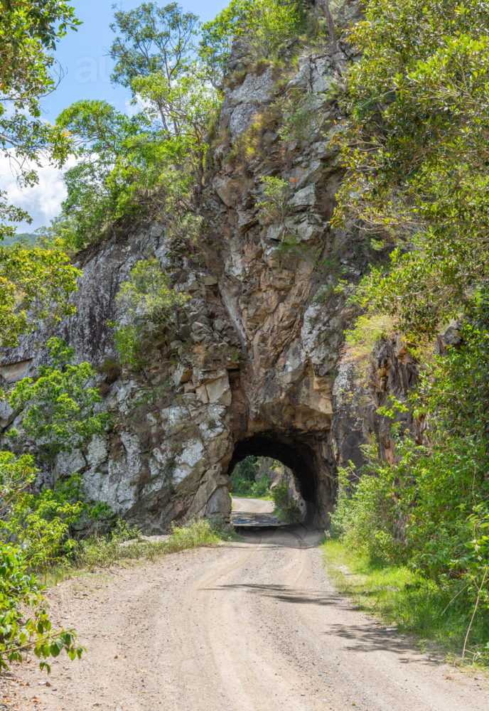Tunnel through solid rock hand dug during the 1800's on the old grafton road - Australian Stock Image