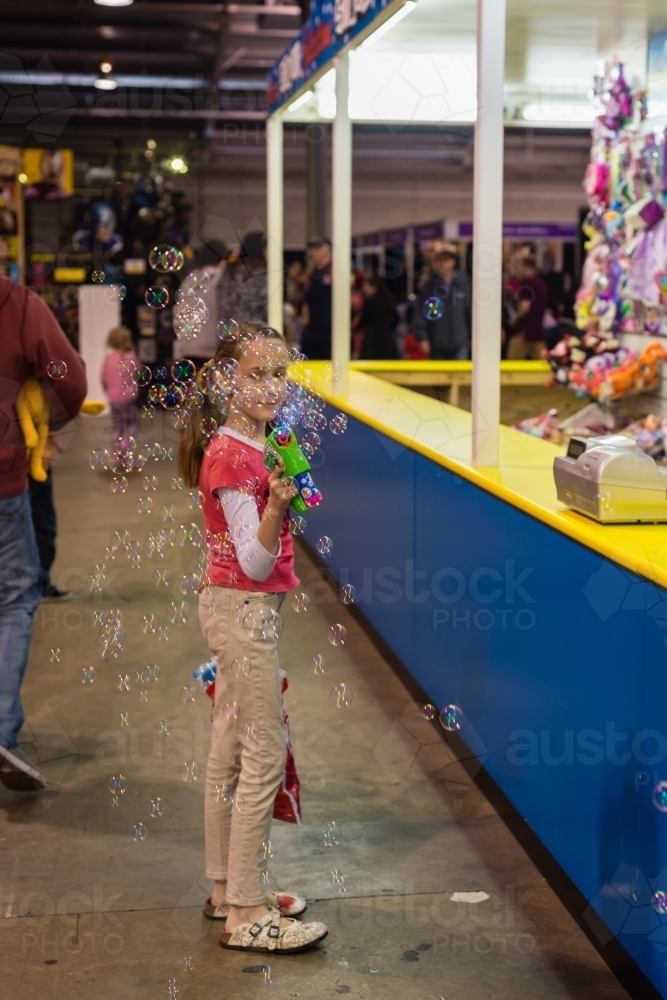 tween girl at royal show with bubble blower - Australian Stock Image