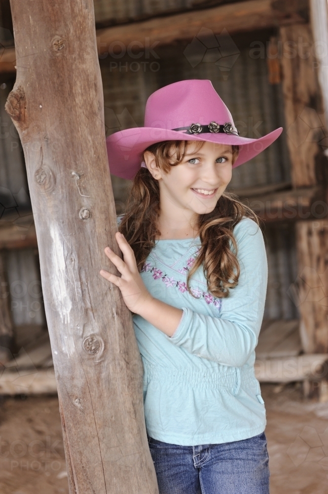 Tween girl in a pink cowgirl hat - Australian Stock Image