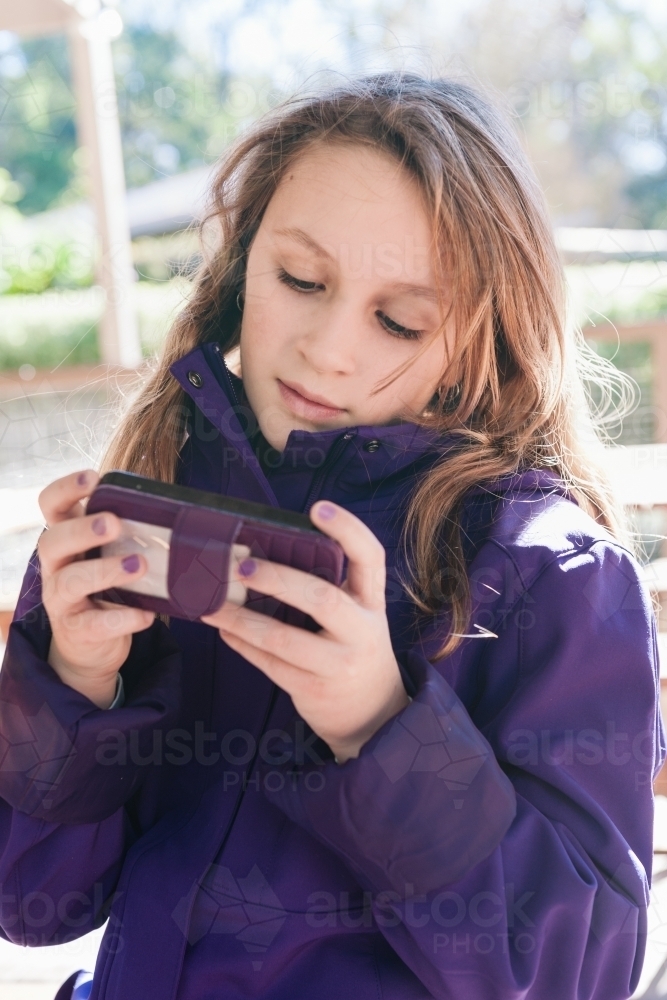 tween girl with mobile phone - Australian Stock Image